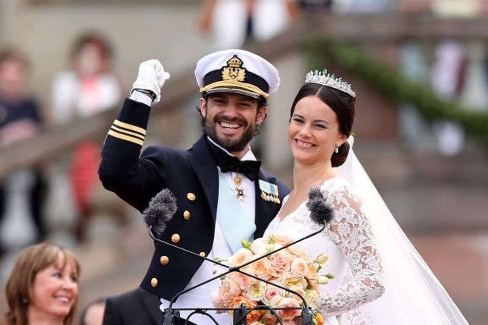 STOCKHOLM, SWEDEN - JUNE 13: Prince Carl Philip of Sweden and his wife Princess Sofia of Sweden salute the crowd after their marriage ceremony on June 13, 2015 in Stockholm, Sweden. (Photo by Ragnar Singsaas/Getty Images)