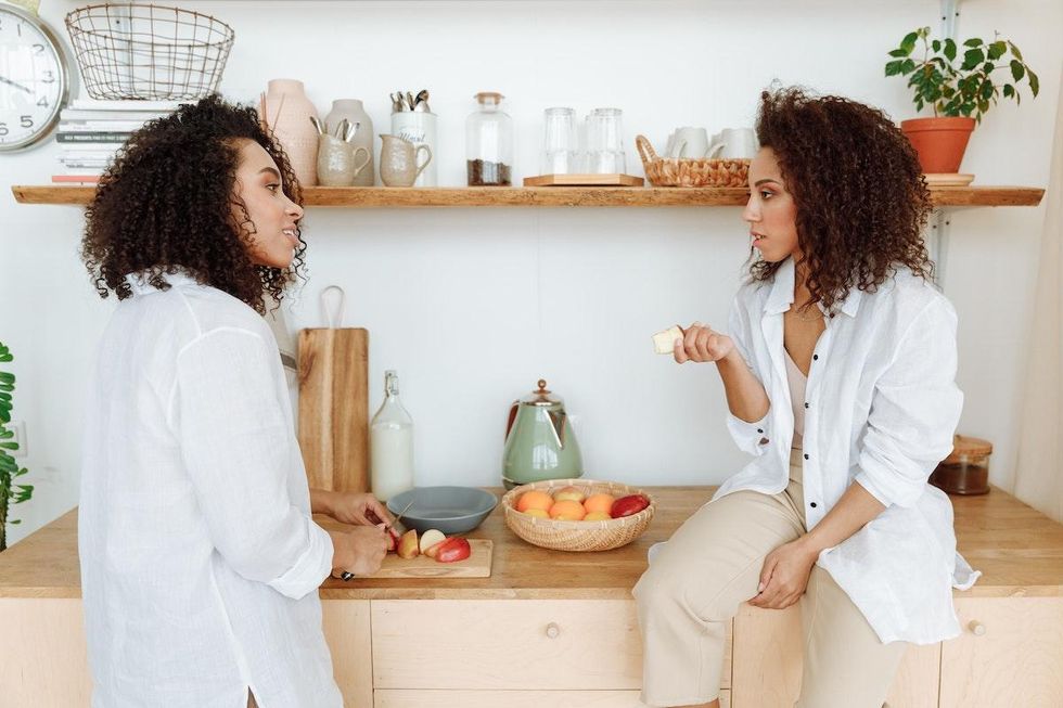 strengthen your sibling relationships sisters talking in the kitchen