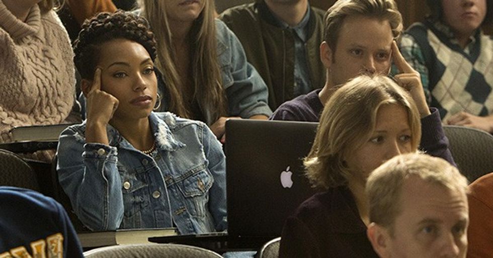 Students sit in a lecture hall with their laptops in Dear White People.