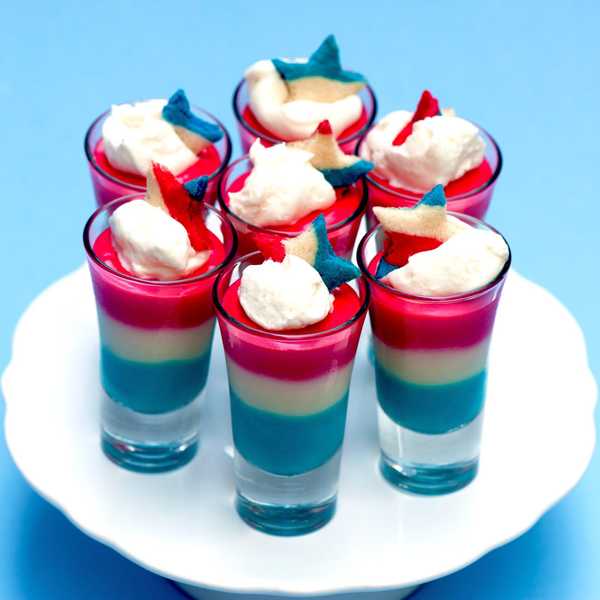 sugar cookie shots that are red white and blue on a white tray
