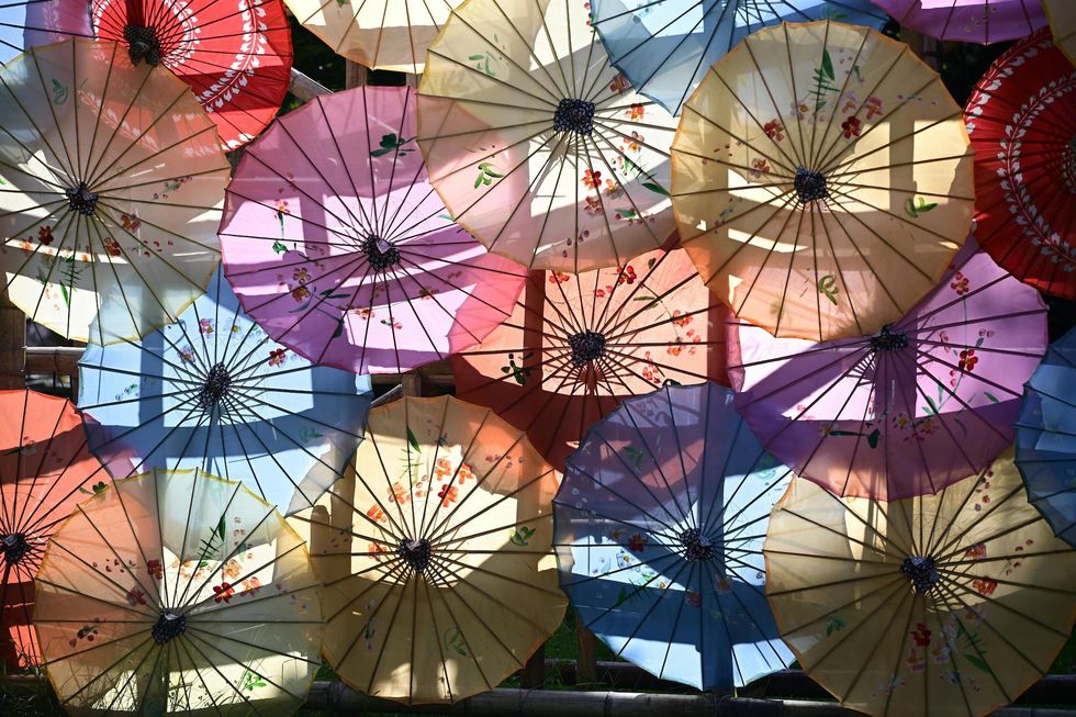 sunlight coming through colorful umbrellas