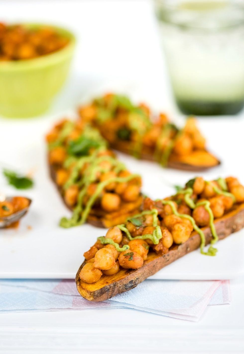 Sweet potato toast with spicy chickpeas and tangy avocado dressing. Quick, healthy, and delicious!