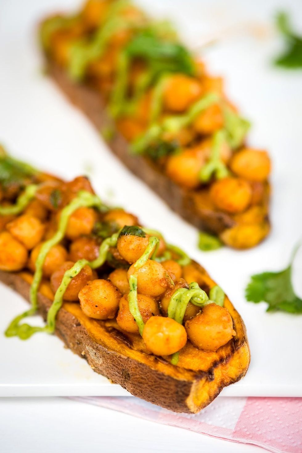 Sweet potato toast with spicy chickpeas and tangy avocado dressing. Quick, healthy, and delicious!