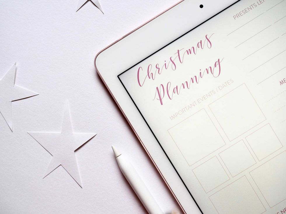 Tablet with "Christmas Planning" page, surrounded by stars and a stylus.