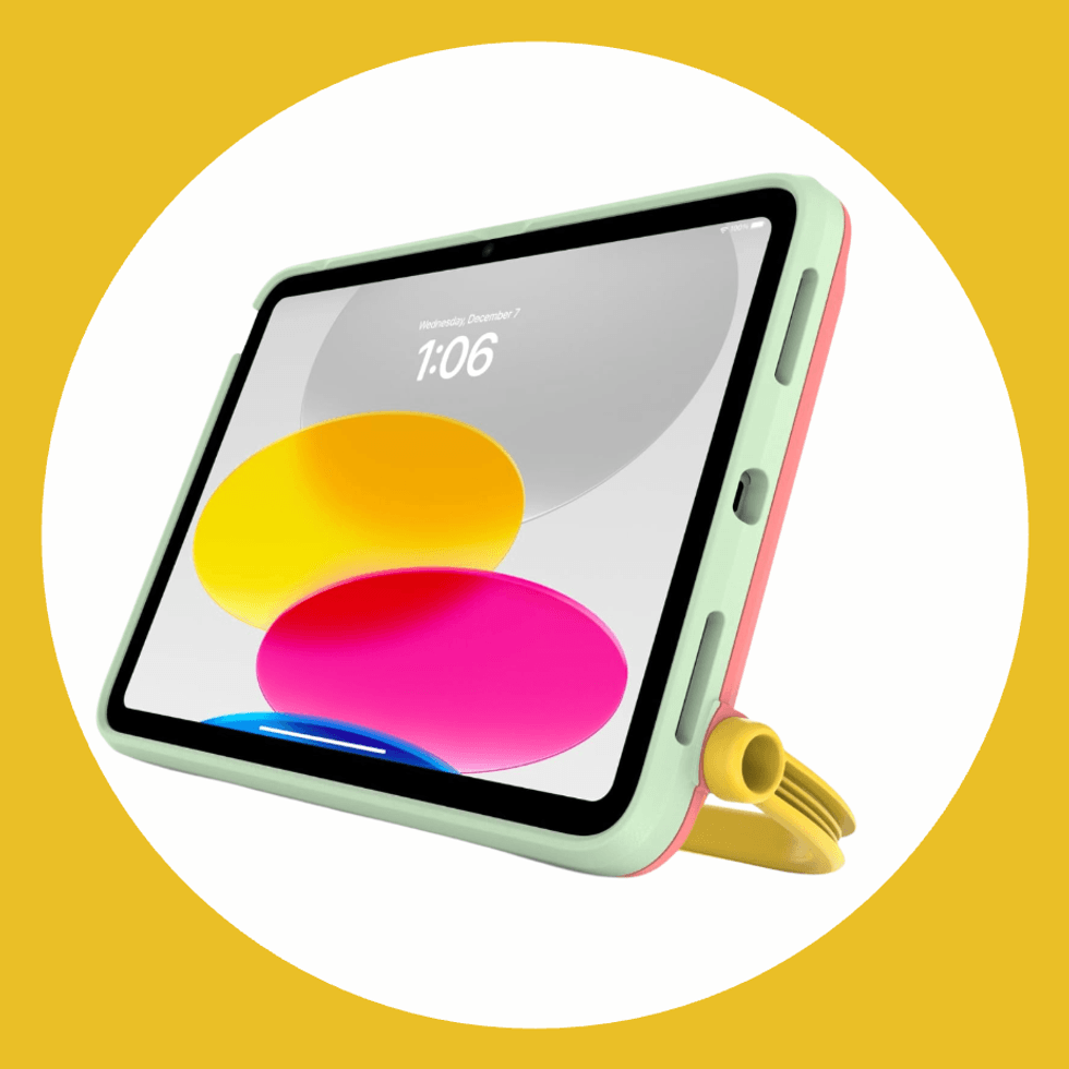 Tablet with colorful case on stand, displaying abstract circles.