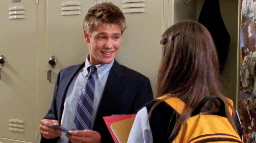 Teen exchange at school lockers, guy in suit, girl in yellow backpack chad michael murray as tristan dugray