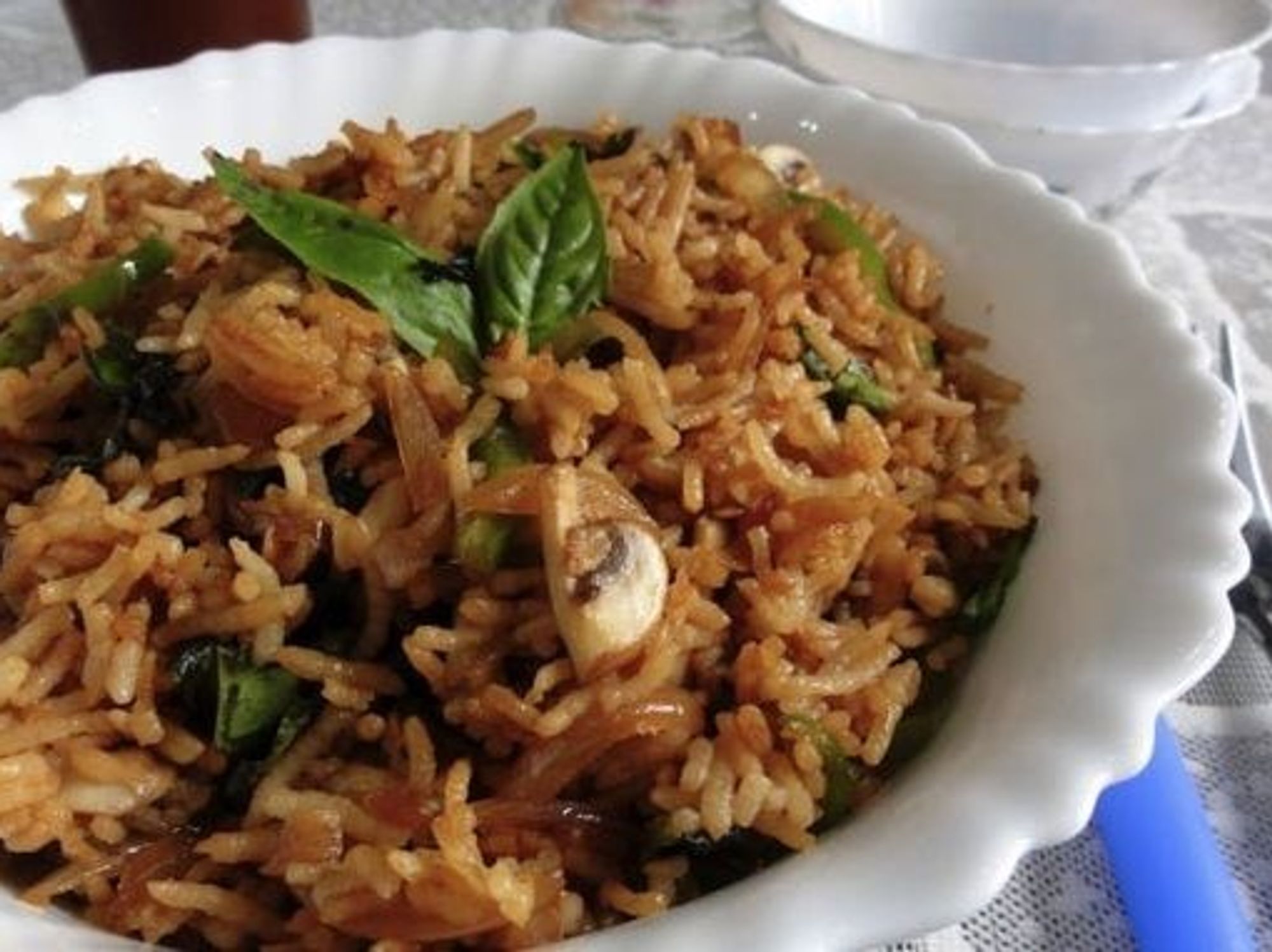 Thai Fried Rice in a white scalloped edge dish