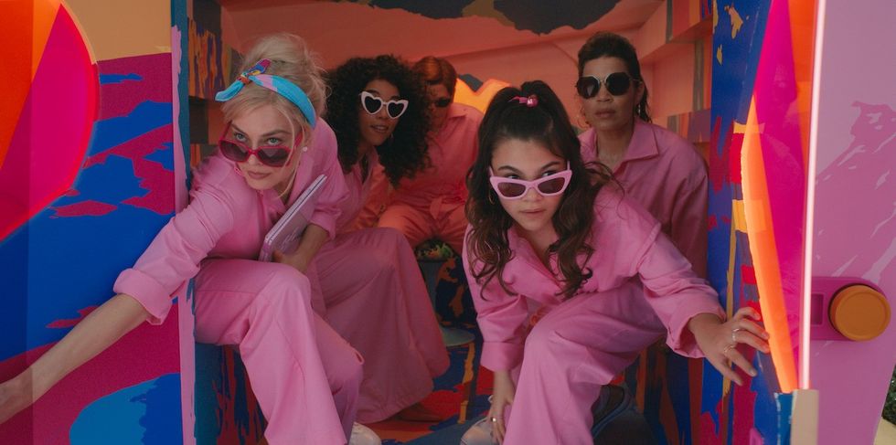 the cast of barbie in their pink jumpsuits