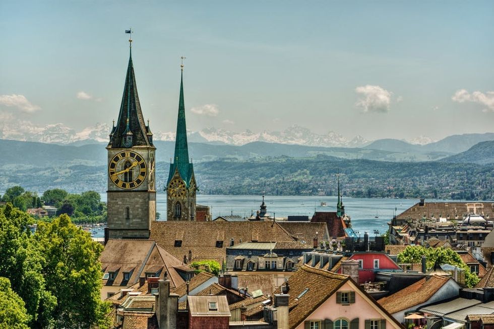 The church towers of Fraumunster and St. Peter rise above the Zurich skyline