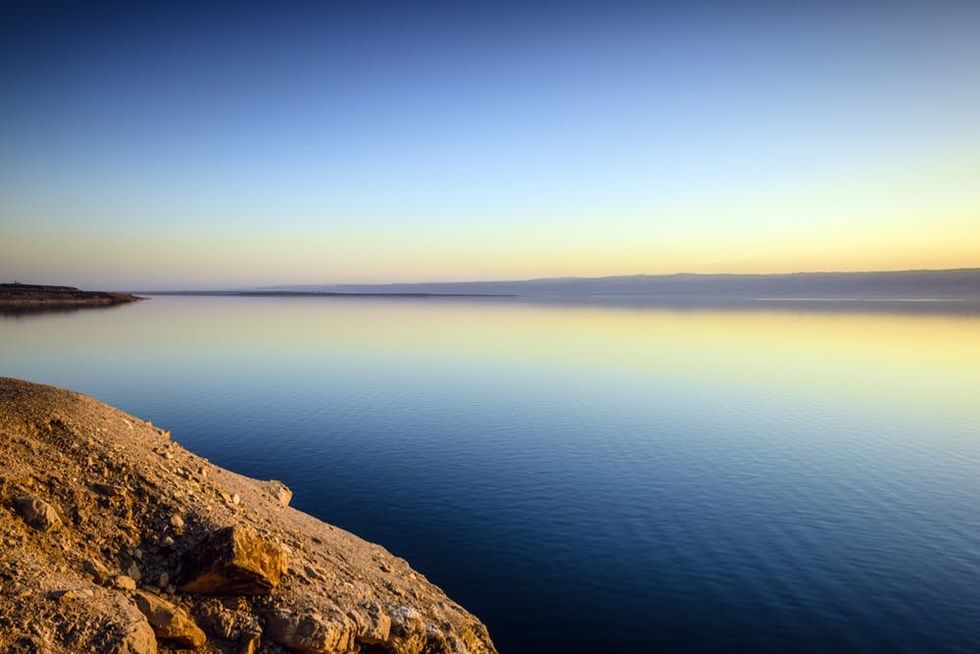 The Dead Sea reflects the colors of the sunset
