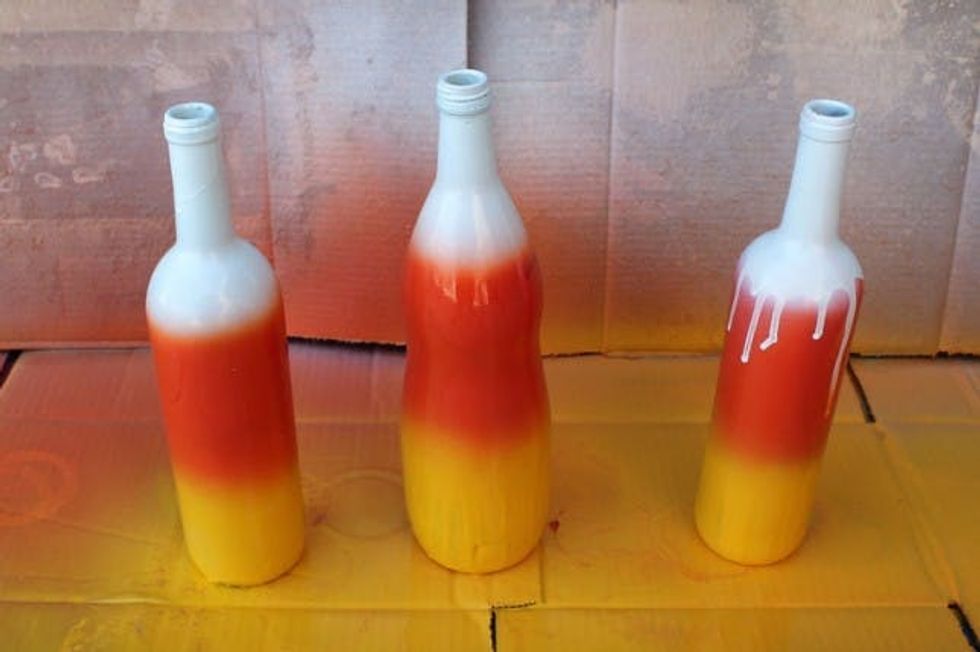 The finished project - candy corn ombre wine bottles.