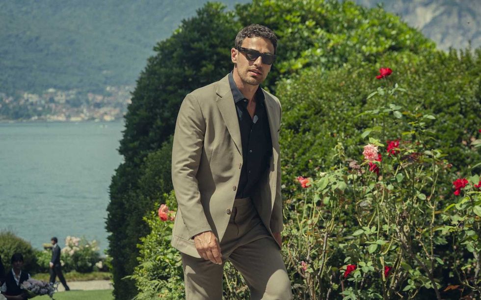 The Gentlemen cast theo james walking through a garden