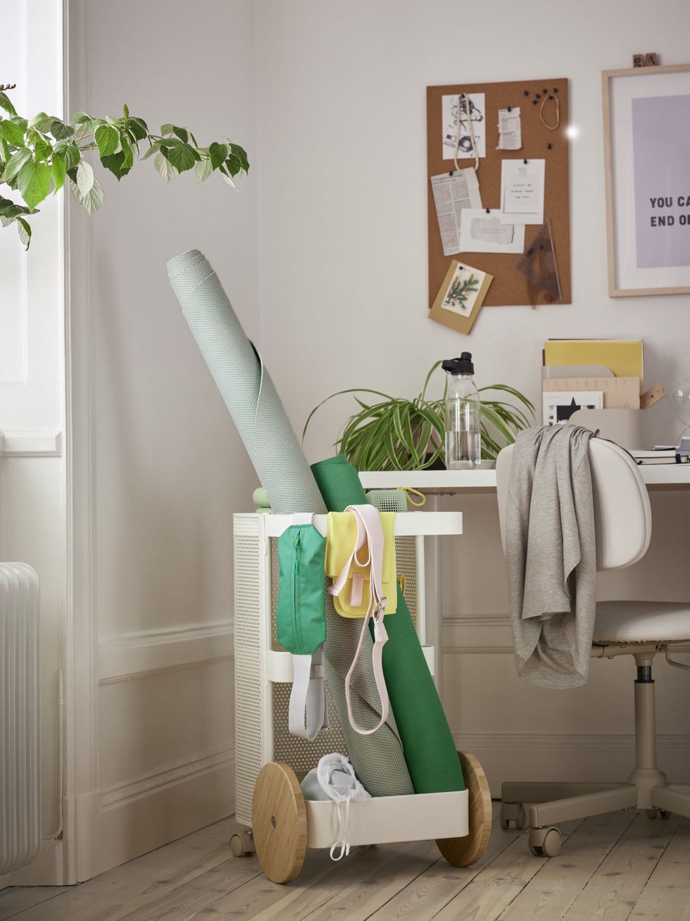 the ikea workout collection includes a rolling storage cart that holds mats, bands, and bags