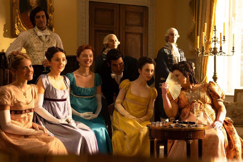 the other bennet sister cast sitting in the living room of the bennet home