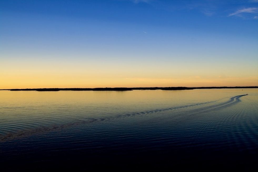 The sun glows over the Baltic Sea between Stockholm and Helsinki shortly before midnight