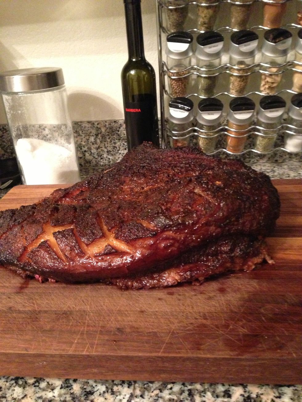 The timing will change brisket to brisket, but after 5-8 hours the internal temperature will reach 195 degrees. More importantly, it should easily fall apart. Let it rest for 30 minutes.