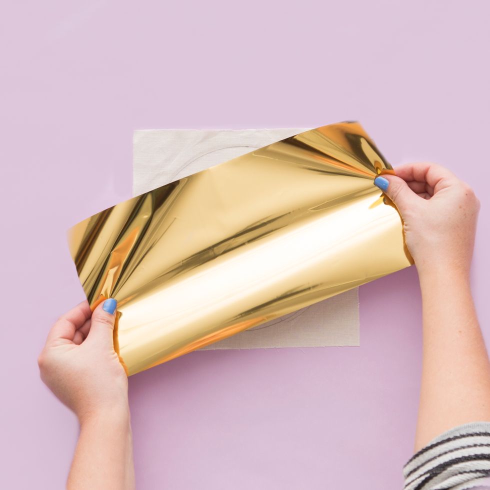 Then lay a sheet of foil over the glue.