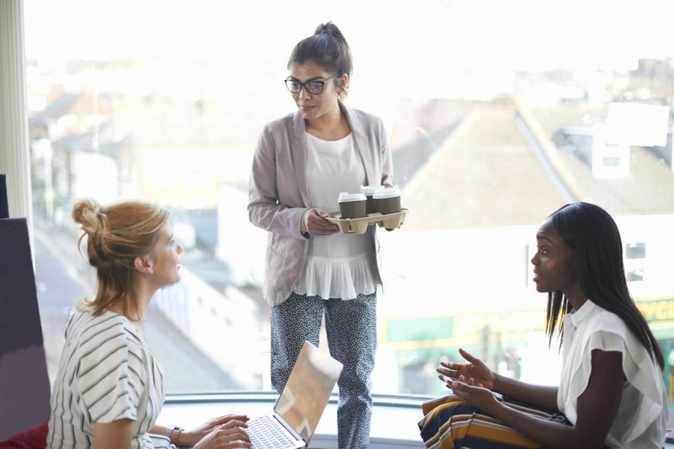 Three coworkers chat during a break