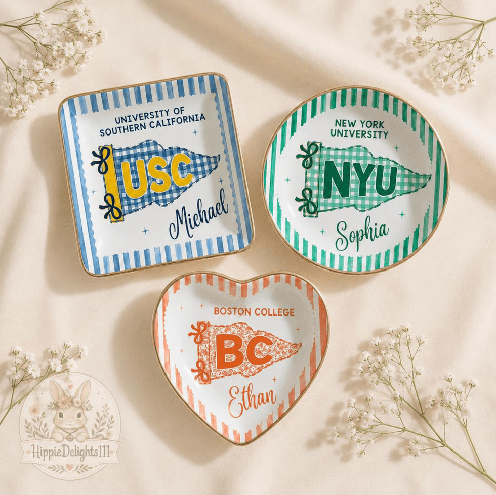 Three personalized college-themed decorative plates on a soft background.