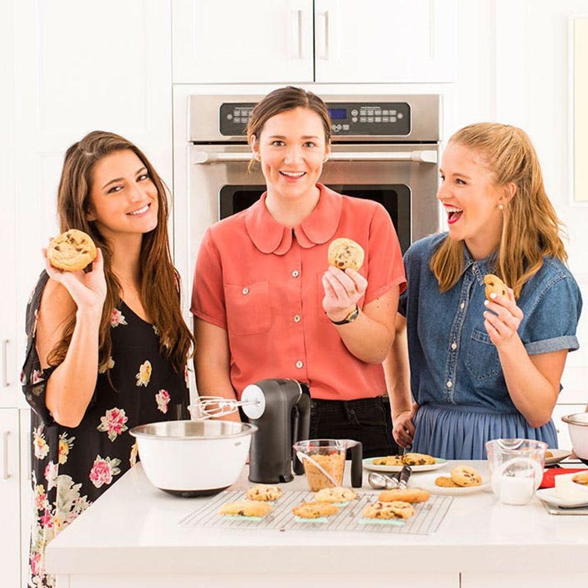 Three women making cookies in a white kitchen using applesauce egg substitute