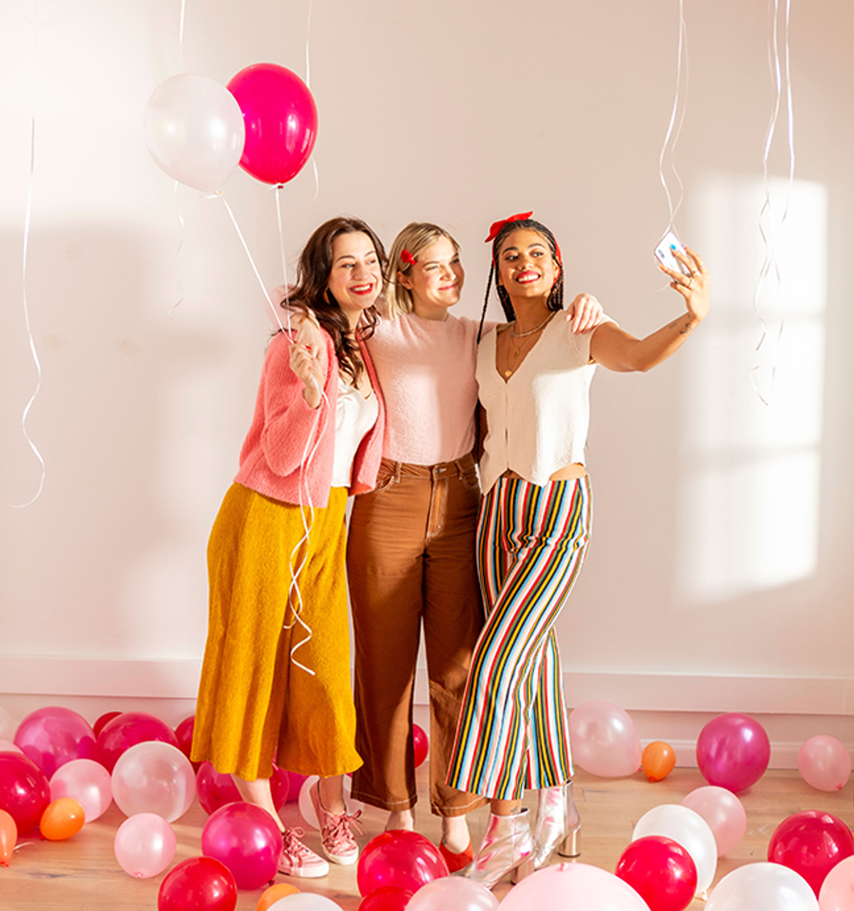 three women taking a picture together