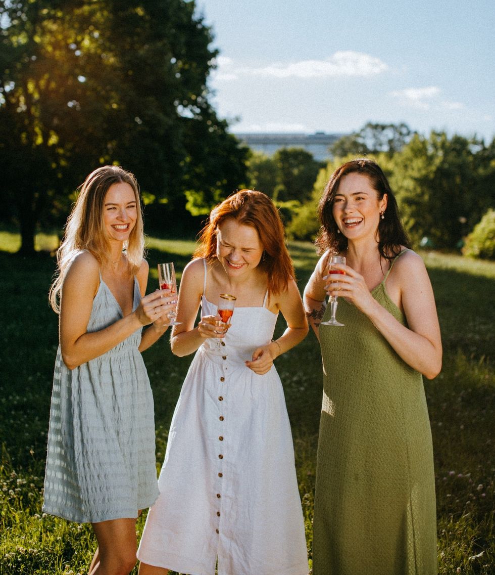 three women with champagne