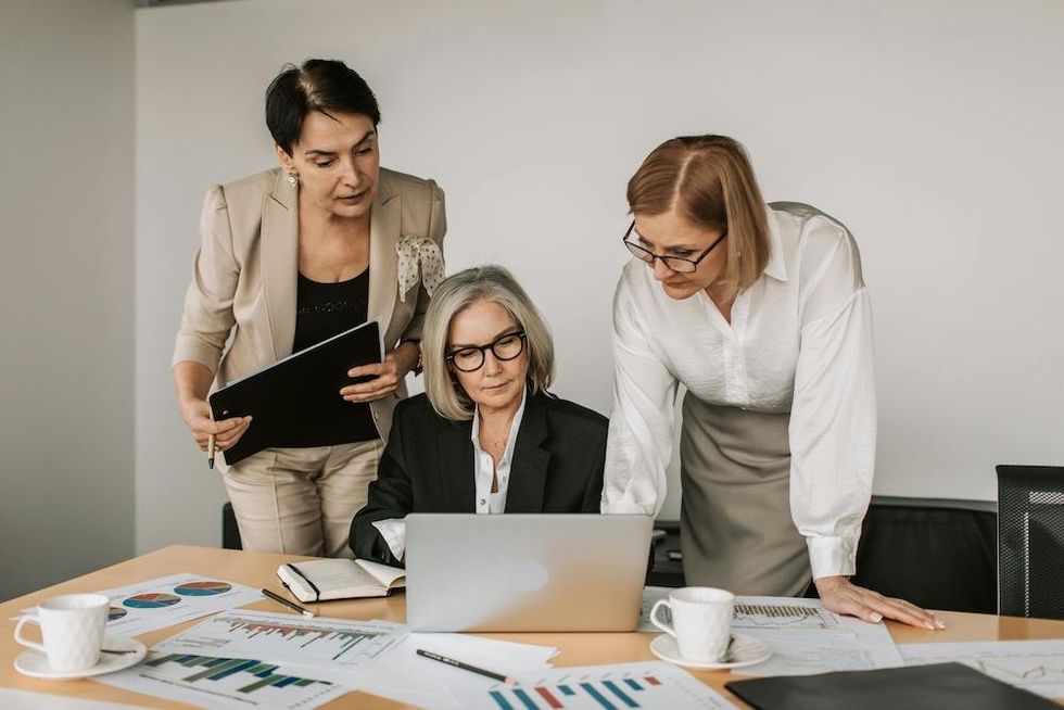 three women working together on a project