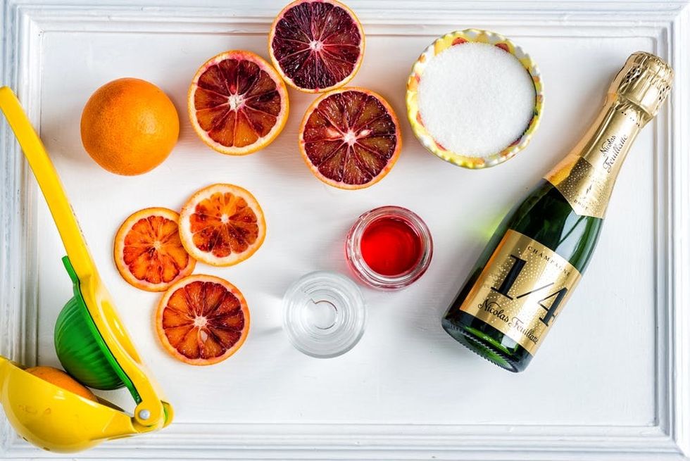 Toast the Oscars with a bubbly blood orange Oscar 89! With homemade blood orange sugar syrup, gin and champagne, it is an Oscar-worthy cocktail!