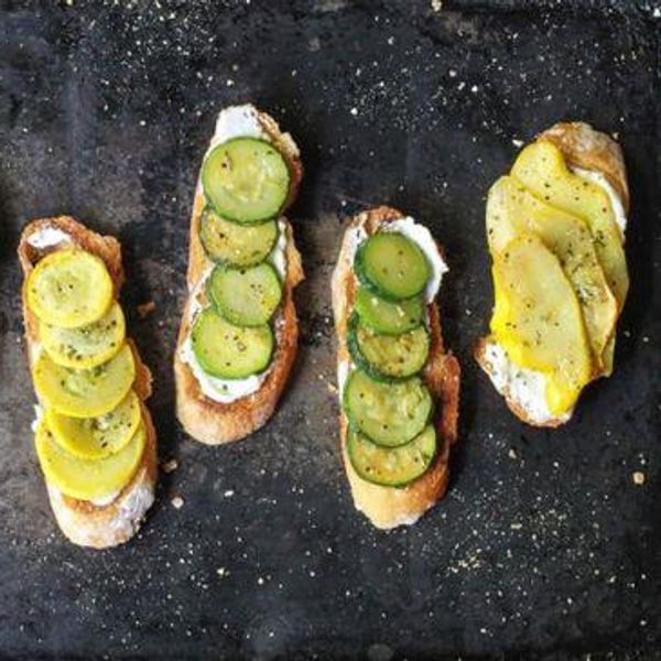 toasted bread with cheese and summer squash slices