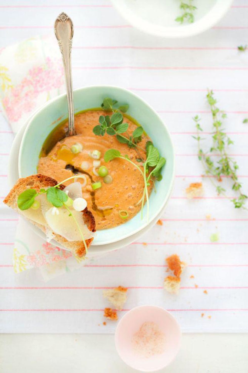tomato soup with toast in a blue bowl