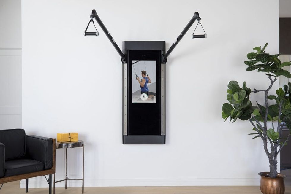 Tonal home gym system against wall