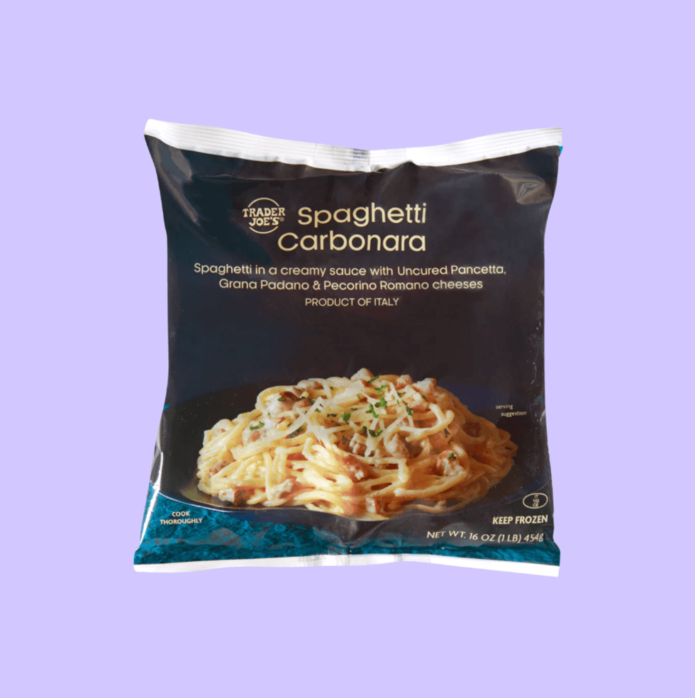 Trader Joe's Spaghetti Carbonara frozen package on a purple background.