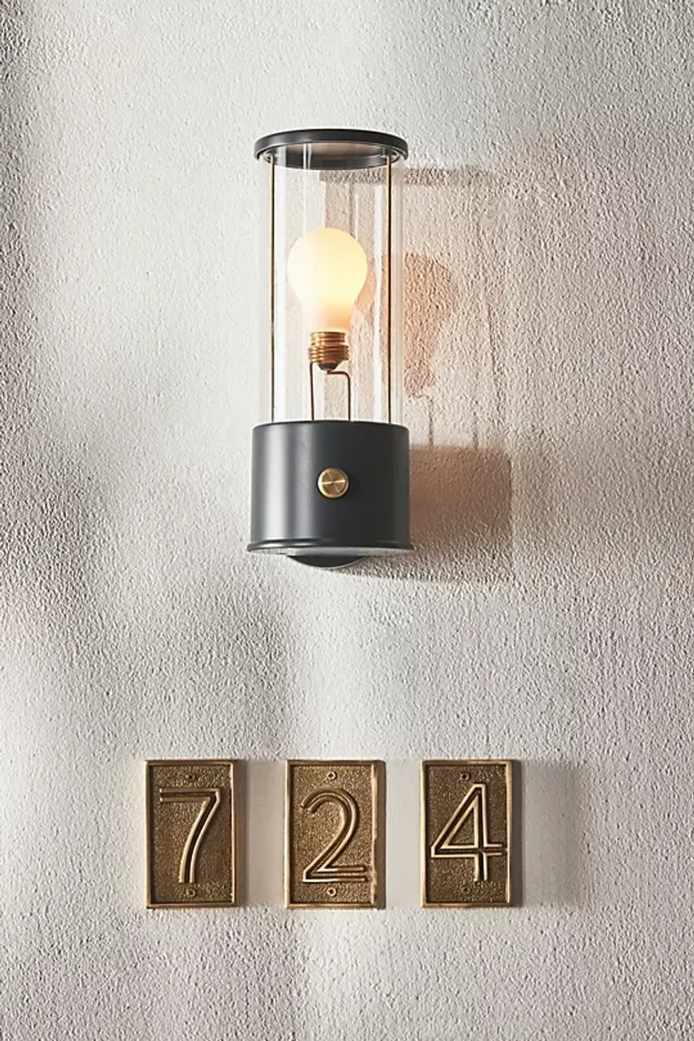 'transparent,' brass wall sconce