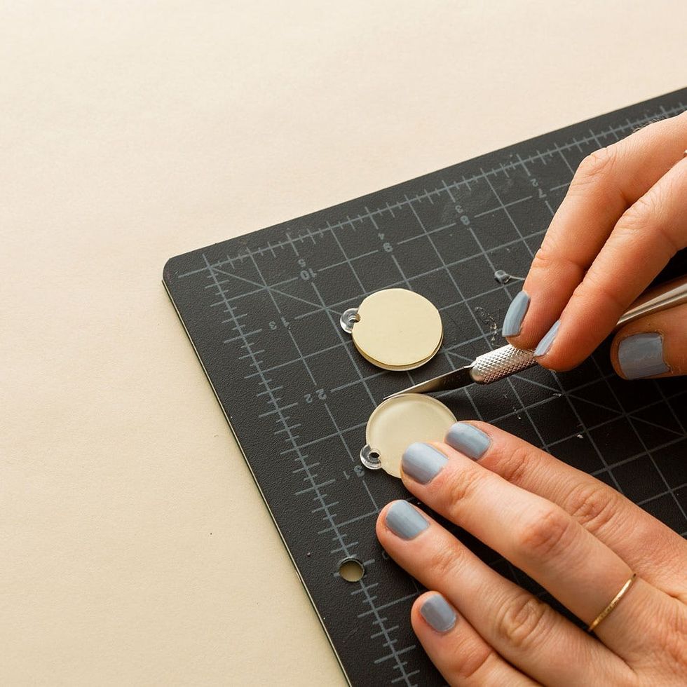 trim away vinyl to cover the acrylic shape