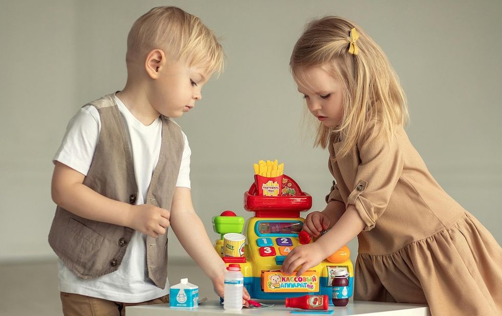 twin boy and girl playing together