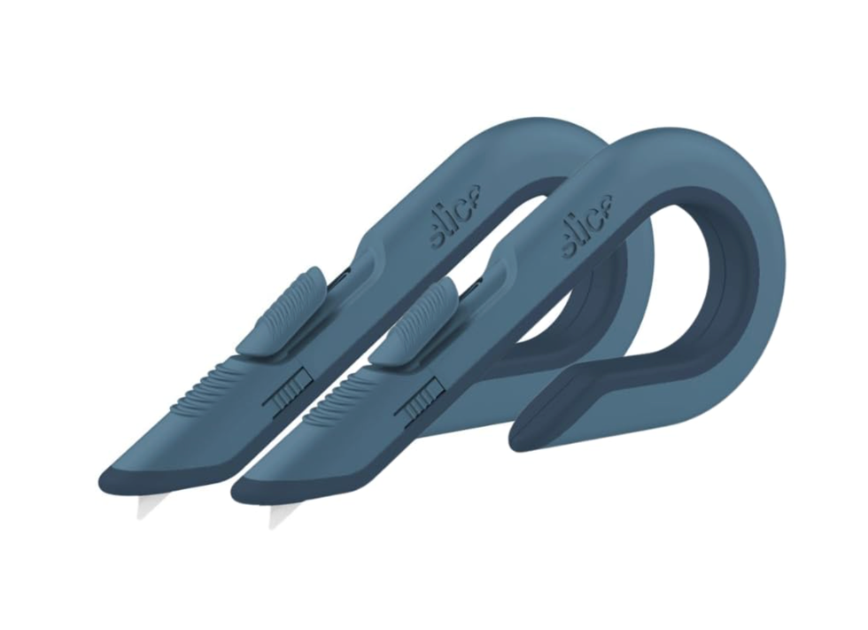 Two blue safety knives with a curved handle design.