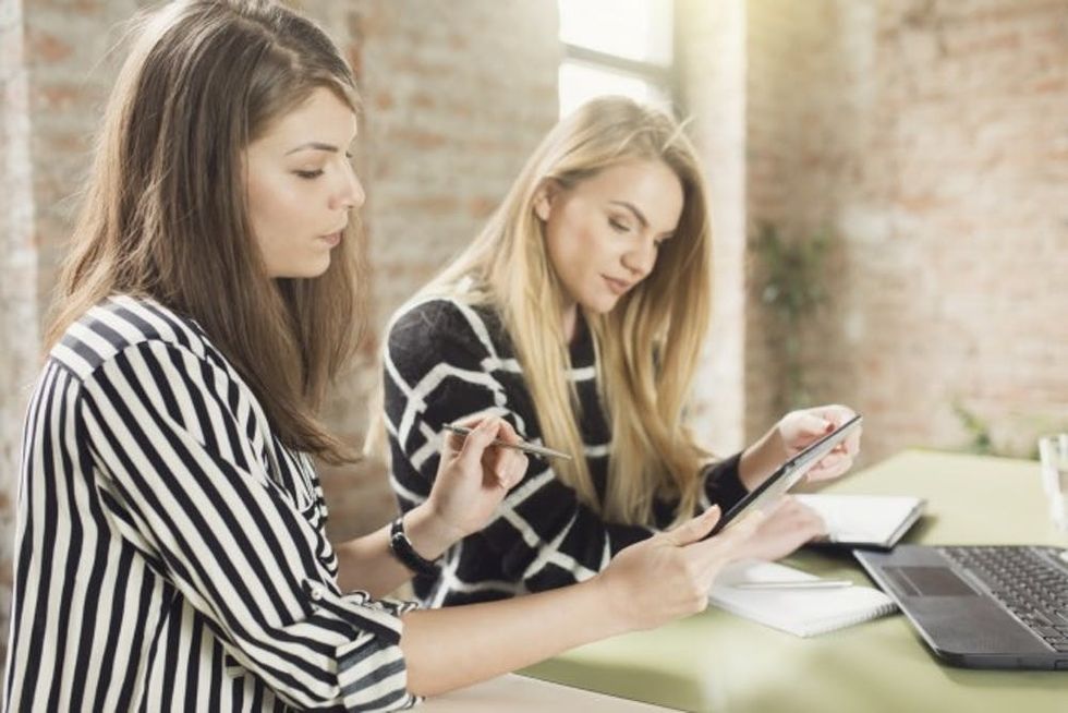 two coworkers in office