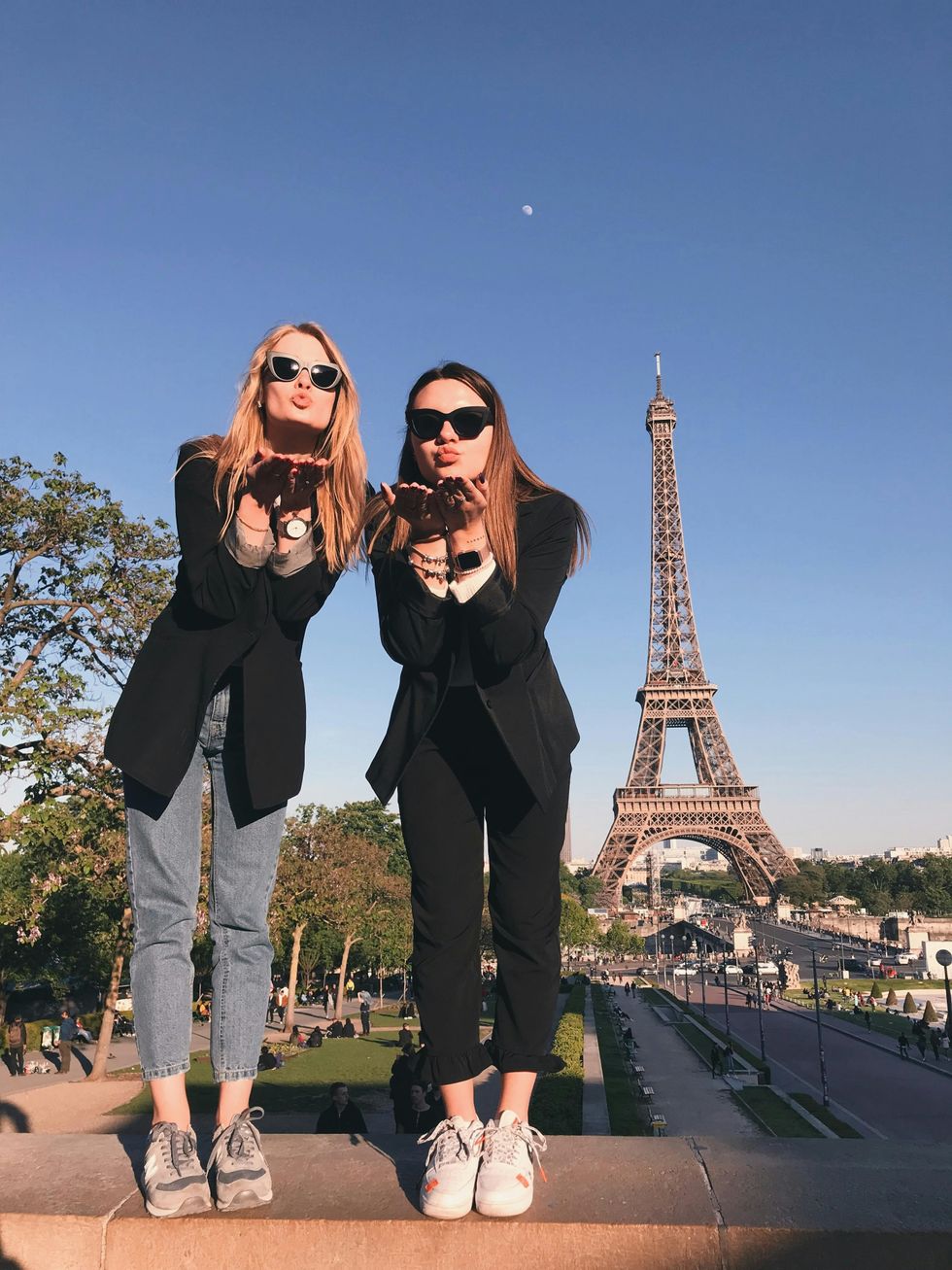 two friends near Eiffel Tower birthday trip ideas