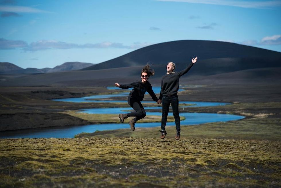 two happy women in iceland