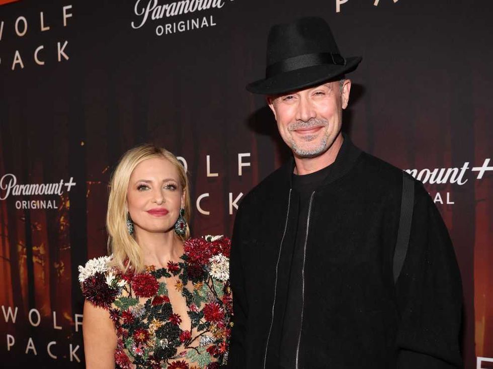 Two people pose at the "Wolf Pack" Paramount+ event in elegant attire.