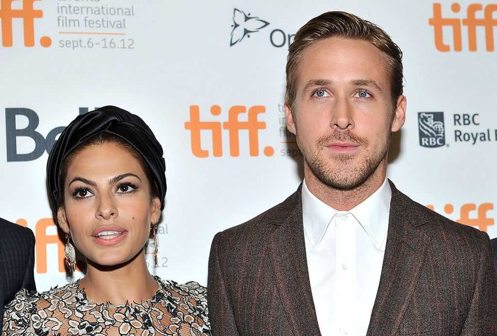 Two people pose on the red carpet at the Toronto International Film Festival event.