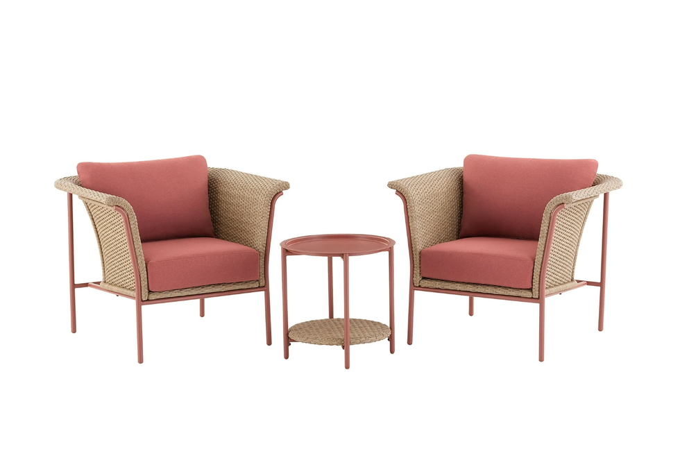 Two pink cushioned chairs with a matching side table on a white background.