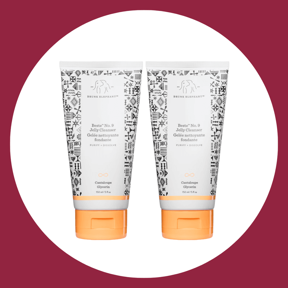 Two tubes of Drunk Elephant Beste No. 9 Jelly Cleanser on a burgundy background.