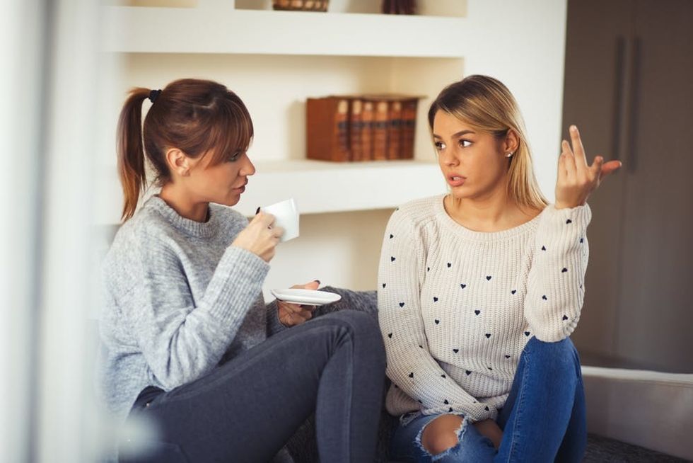 Two women have a serious conversation