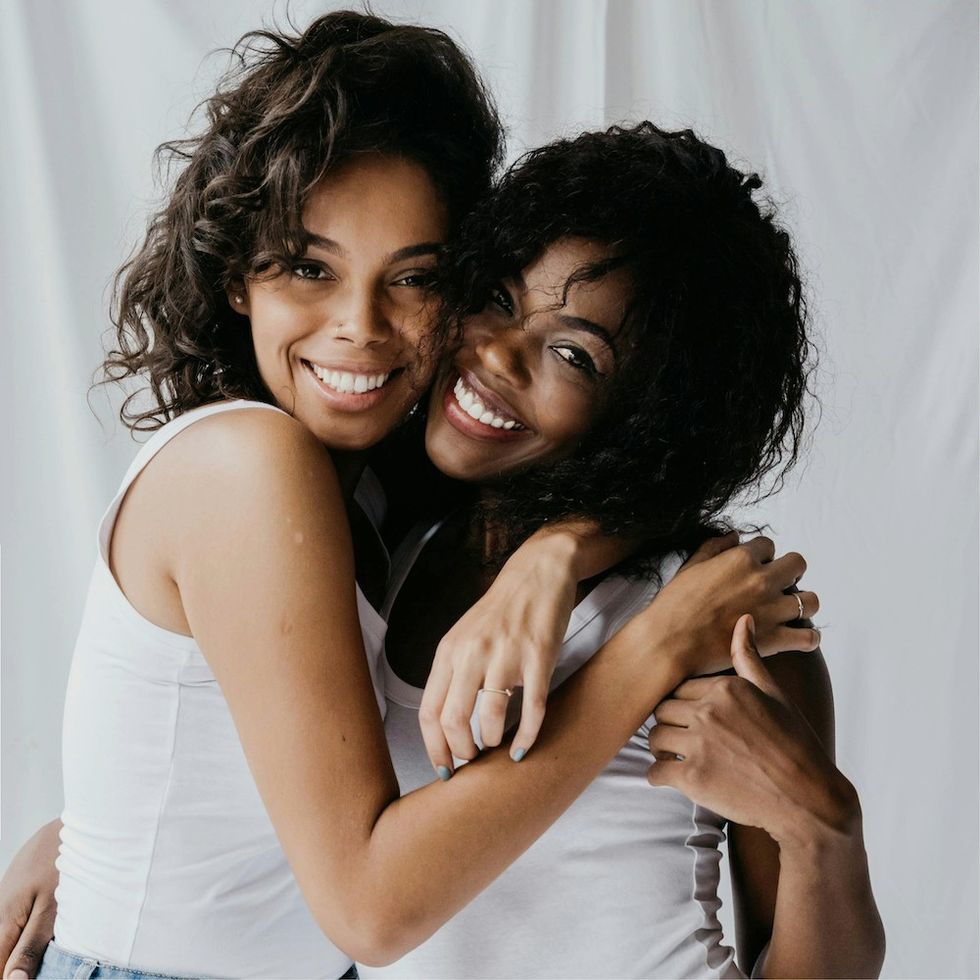 two women hugging and smiling