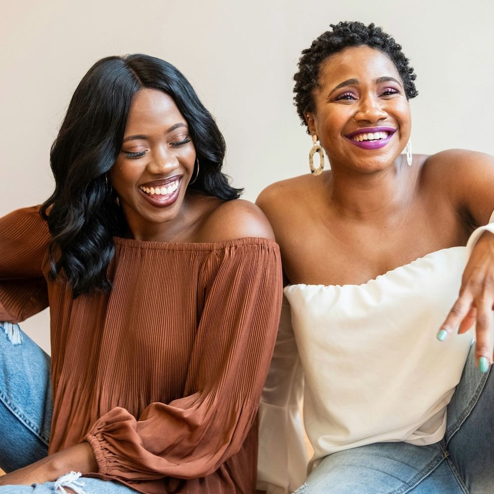 two women laughing together