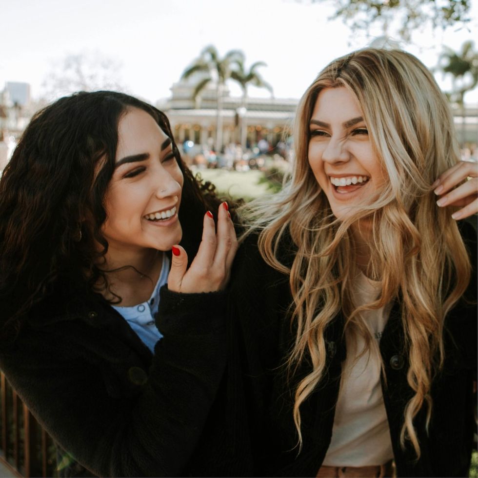 two women laughing together
