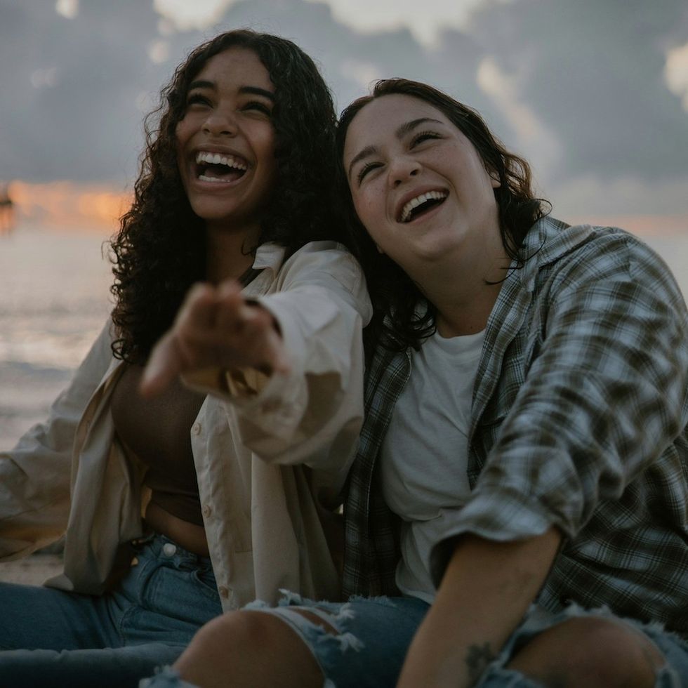 two women laughing together