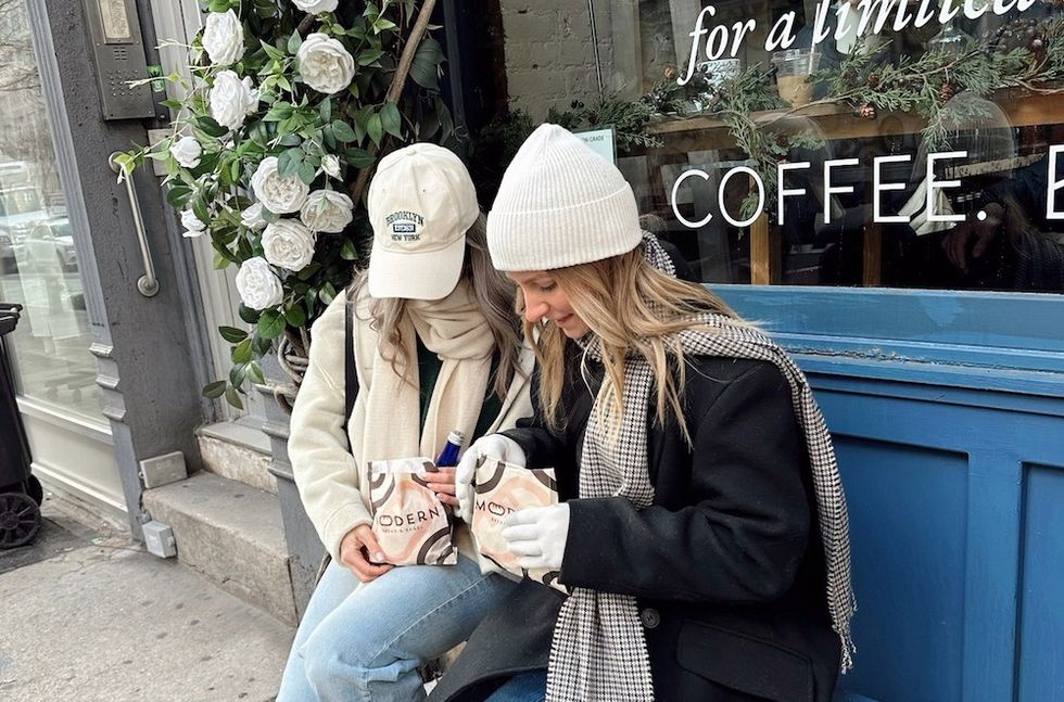 two women outside of a coffee shop
