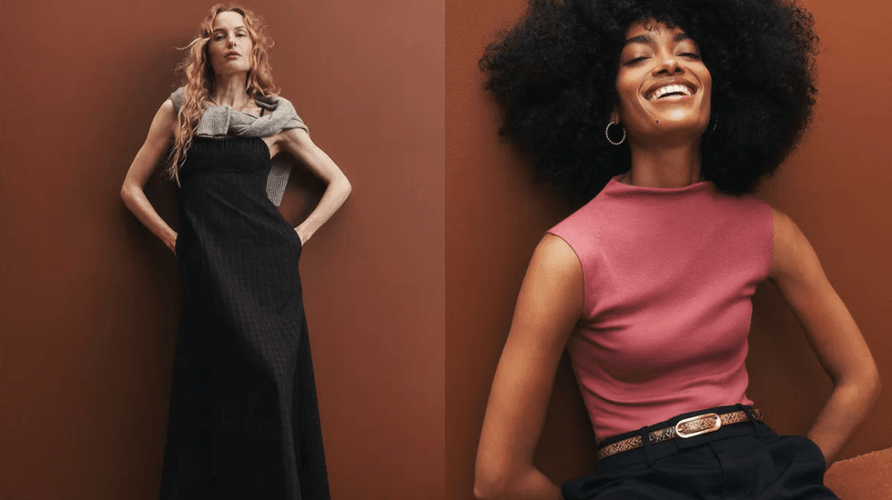 Two women pose stylishly against a brown backdrop, one smiling, the other standing.